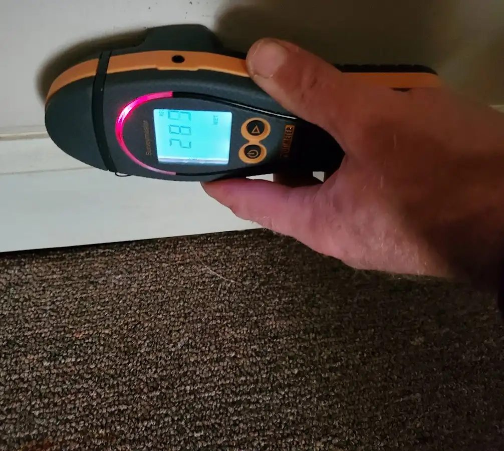 Moisture detection at baseboard during Storm Damage Restoration in North Versailles